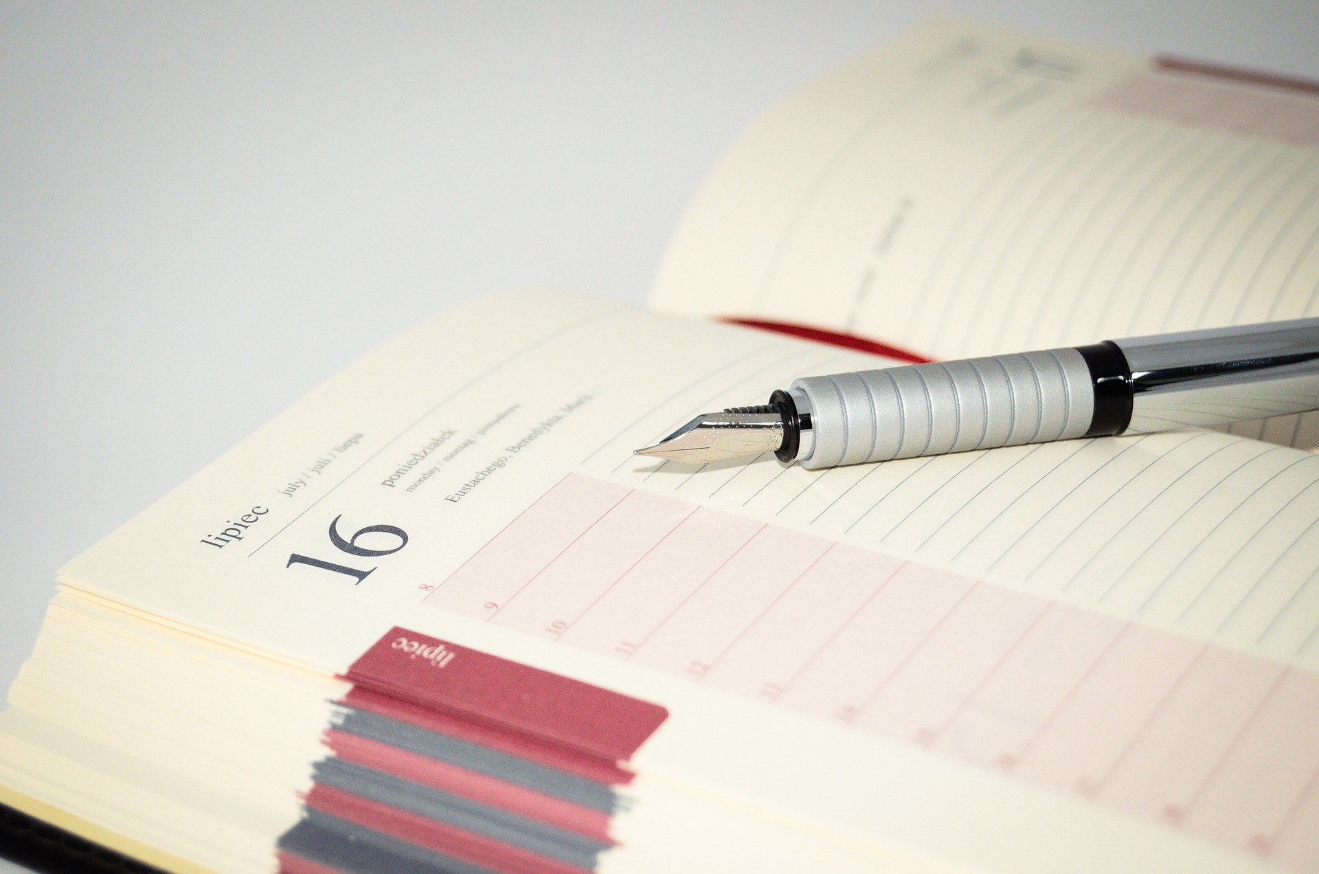 a notebook and calendar to help keep track of dates and obligation to stay effective and organized