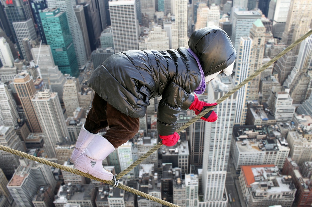 child on a tight rope being courageous